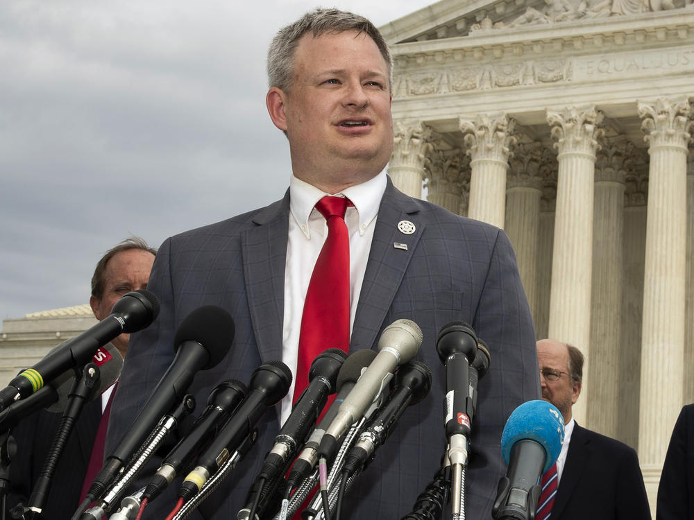 South Dakota Attorney General Jason Ravnsborg speaks to reporters in front of the U.S. Supreme Court in Washington on Sept. 9, 2019.