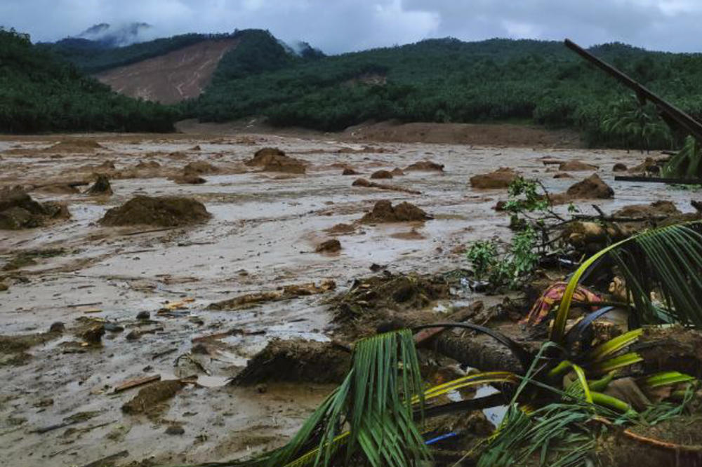 A photo provided by the Philippine Coast Guard shows a landslide area at Baybay City, Leyte province, central Philippines, on Monday.