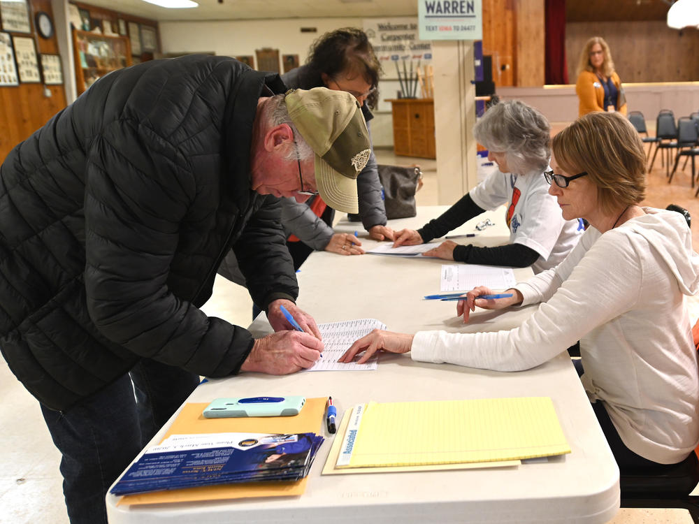 Caucusgoers are seen here in Carpenter, Iowa, on Feb. 3, 2020. The Democratic National Convention approved a resolution Wednesday that revamps its presidential nominating process, which means Iowa could lose its 