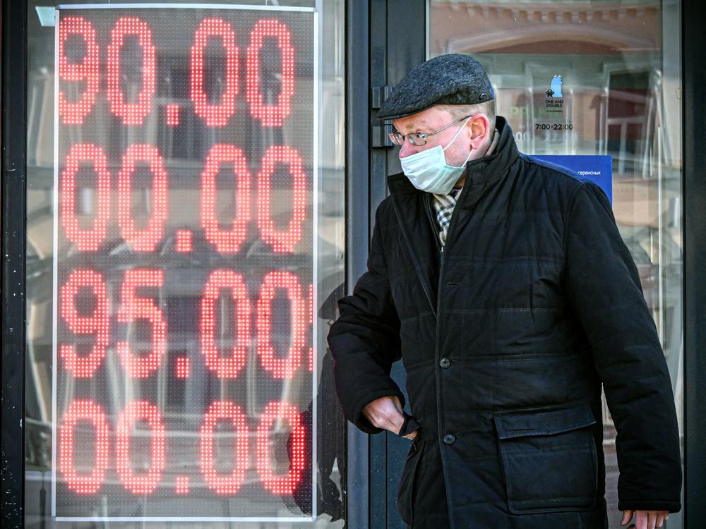 A man walks past a currency exchange office in central Moscow on Feb. 28. The U.S. and its allies have imposed severe economic sanctions on Russia since its invasion of Ukraine.