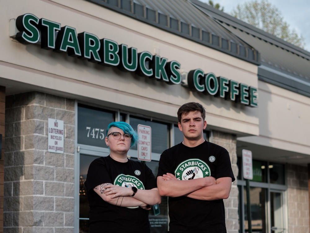 Starbucks shift supervisor Gailyn Berg and barista Tim Swicord outside of their store in Springfield, Virginia.