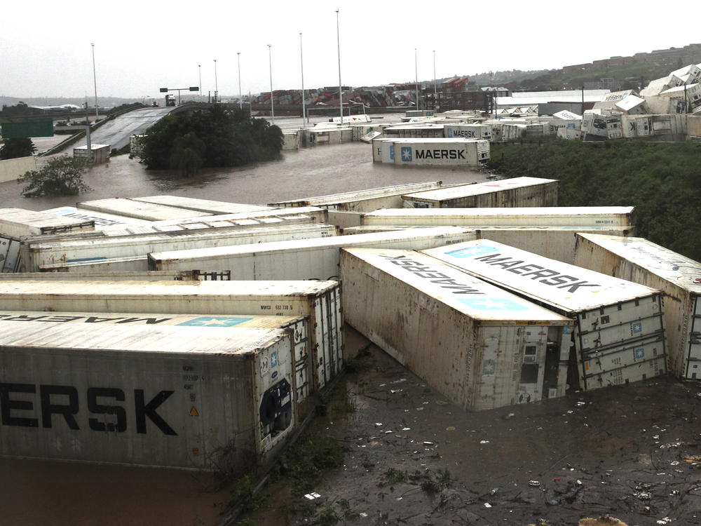 Shipping containers carried away and left in a jumbled pile by floods in Isipingo, south of Durban, South Africa on Tuesday.
