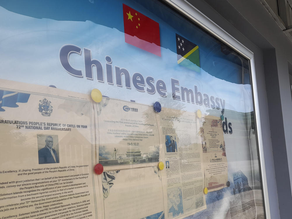 A display case of photos is seen outside the Chinese Embassy in Honiara, Solomon Islands, April 2, 2022.