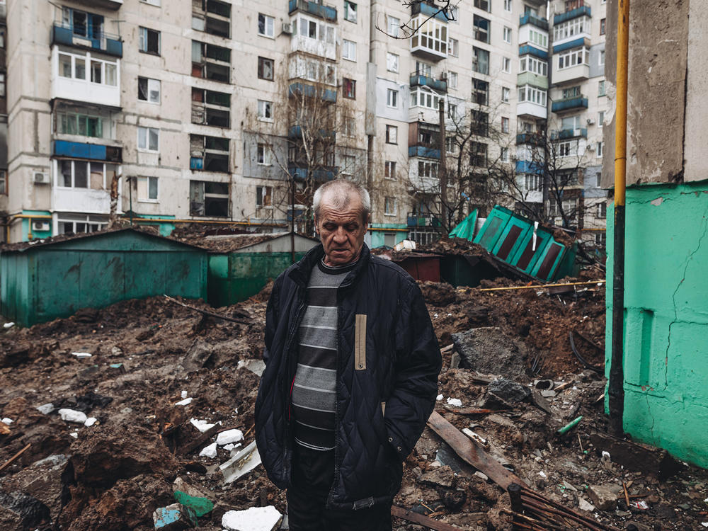 An Ukrainian man stands among the ruins at a residential area damaged by shelling in Lysychansk, Ukraine, on Wednesday.