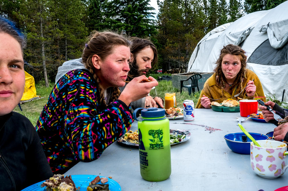 Planters gather for dinner every night at the end of the work day. Meals are provided by in-camp cooks, though each planter pays 