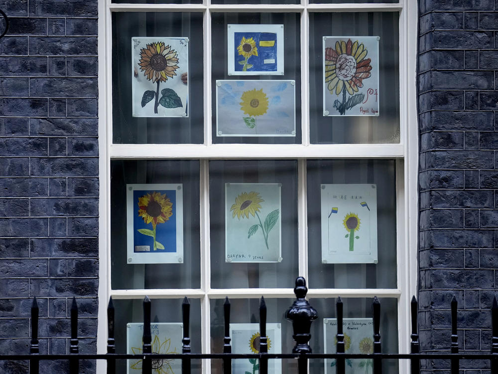 Pictures made by children in solidarity with Ukraine are displayed in a window at 10 Downing Street in London in March.