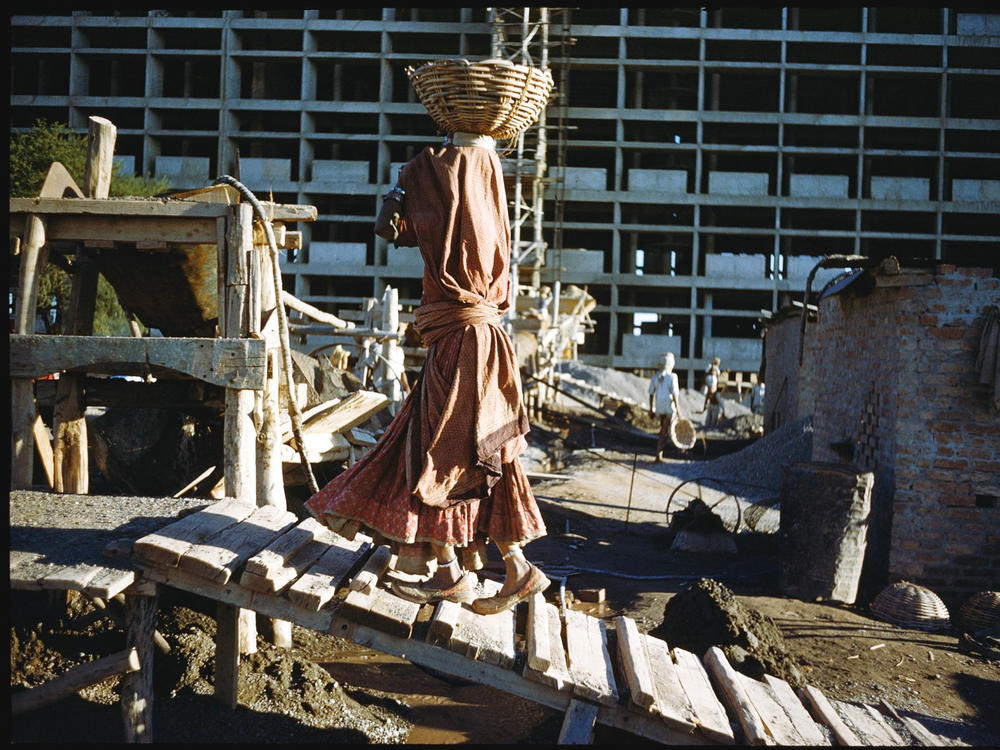 Women were an integral part of the construction effort. Among their jobs: Carrying cement for a building project in Chandigarh, India in 1956.