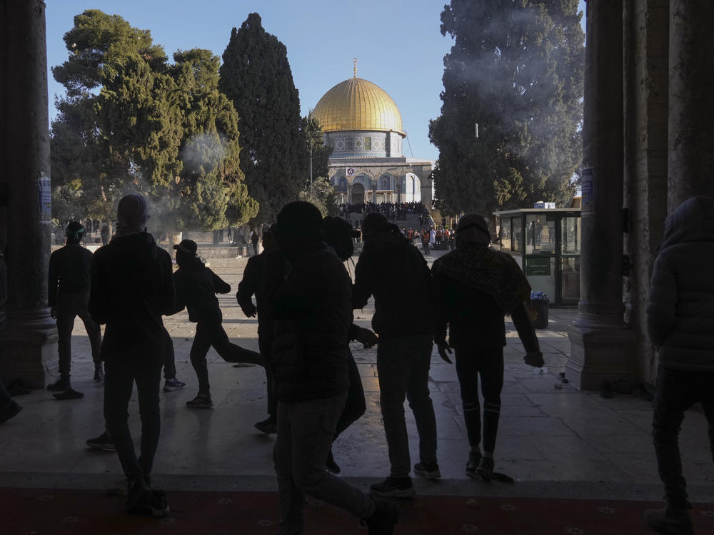 Palestinians clash with Israeli security forces at the Al Aqsa Mosque compound in Jerusalem's Old City Friday, April 15, 2022.