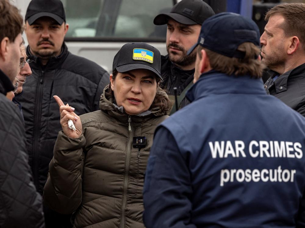 Ukraine's Prosecutor General Iryna Venediktova visits a mass grave in Bucha, on the outskirts of Kyiv, on April 13, 2022. The International Criminal Court's chief prosecutor to Bucha visited as the front in Russia's invasion shifted eastward and new allegations of crimes inflicted on locals emerged.