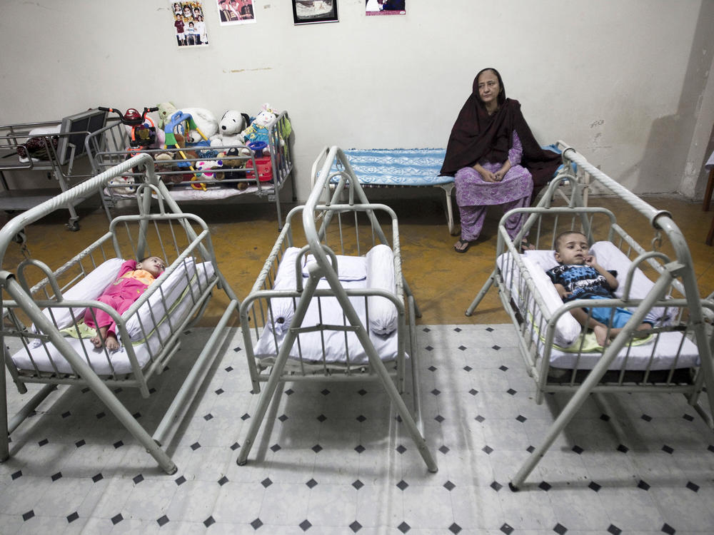 Bilquis Edhi watched over abandoned children in cradles at the Edhi orphanage in Karachi in 2010. Over the years, thousands of children have been left in the network of cradles outside Edhi centers she set up across Pakistan.