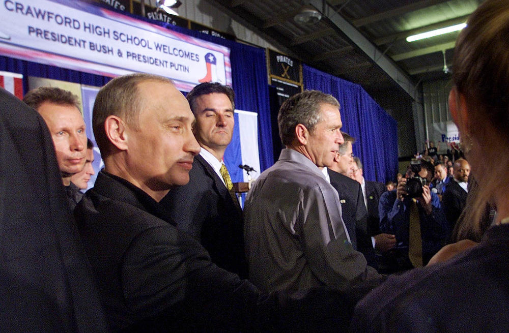 Bush and Putin shake hands with students after speaking at Crawford High School.