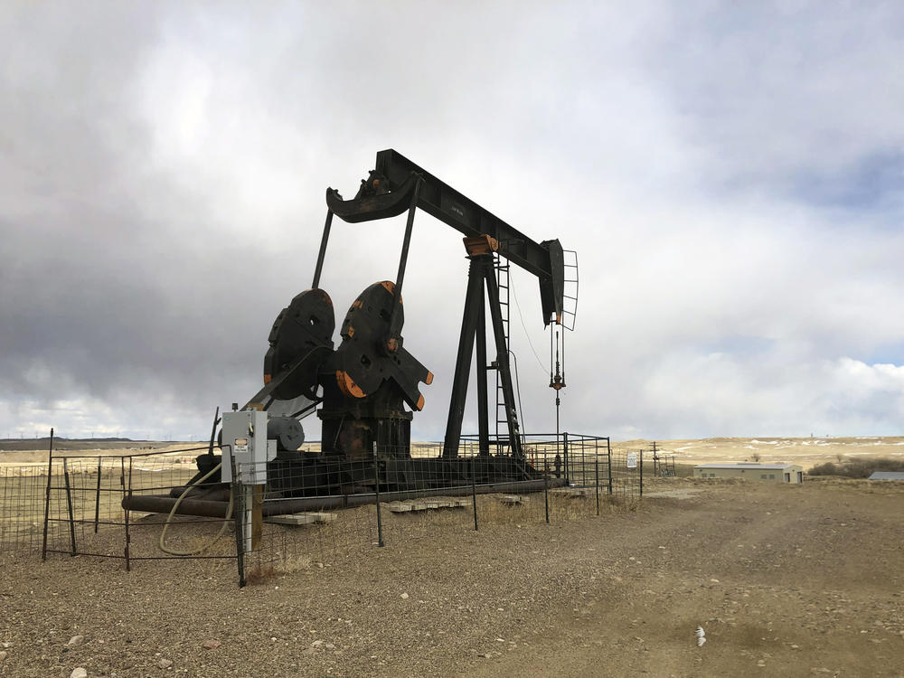 An oil well is seen east of Casper, Wyo., on  Feb. 26, 2021. The Biden administration is raising royalty rates that companies must pay for oil and natural gas extracted from federal lands.