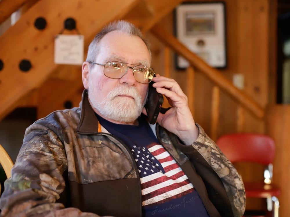 Ron Johnson in his log house in Butte, Alaska.