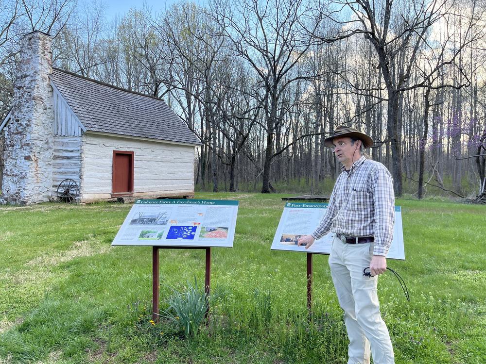 Matt Reeves, a former employee of Montpelier who was fired this week, is pictured outside of the historic Gilmore cabin at Montpelier.