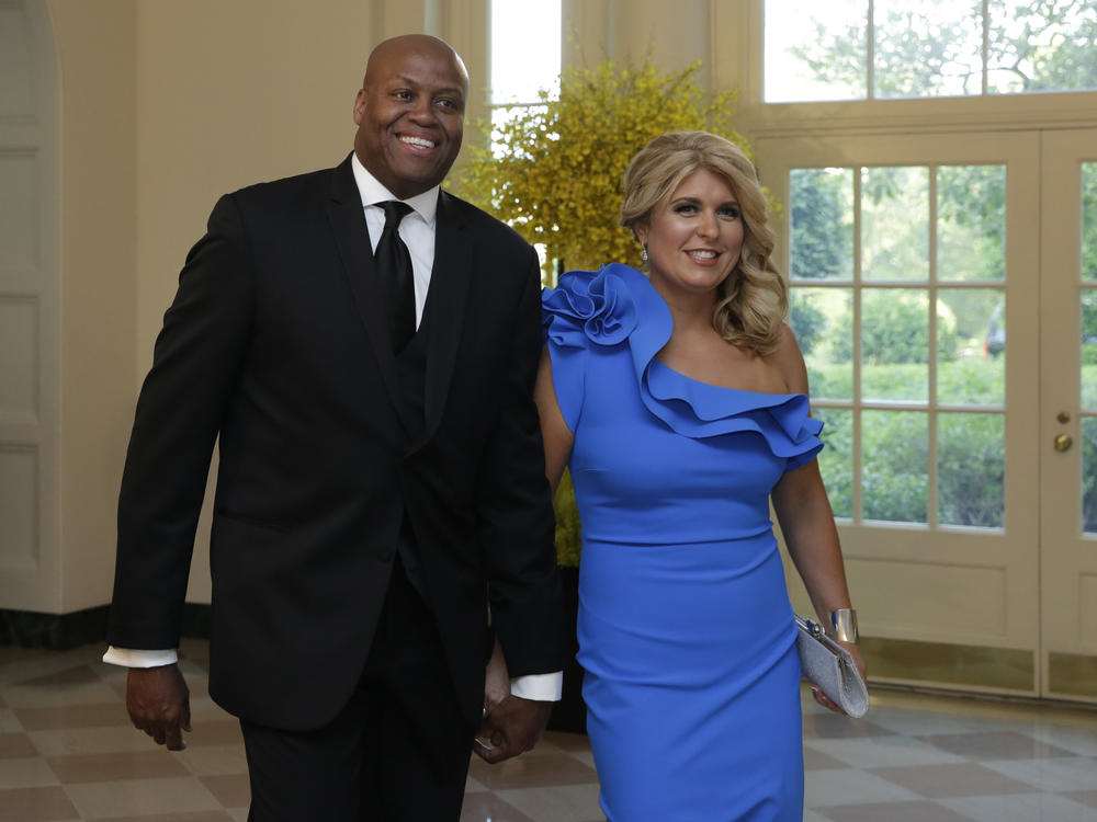 Craig Robinson and his wife, Kelly Robinson, have filed a lawsuit against a Milwaukee-area private school over issues of inclusiveness and alleged racism. Here, they arrive at a state dinner at the White House in 2016.