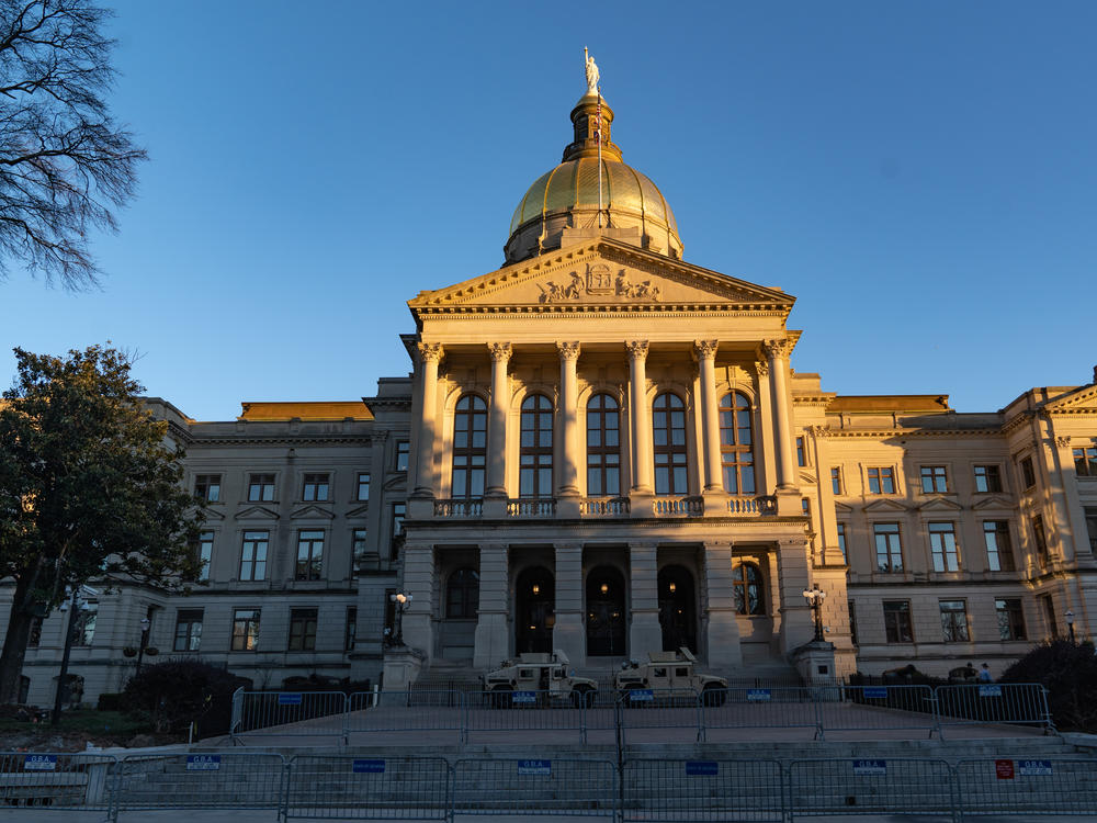 A file photo of the Georgia State Capitol in Atlanta. In a sign of the growing influence of conspiracy theories, a bipartisan mental health bill was almost derailed by unfounded accusations.