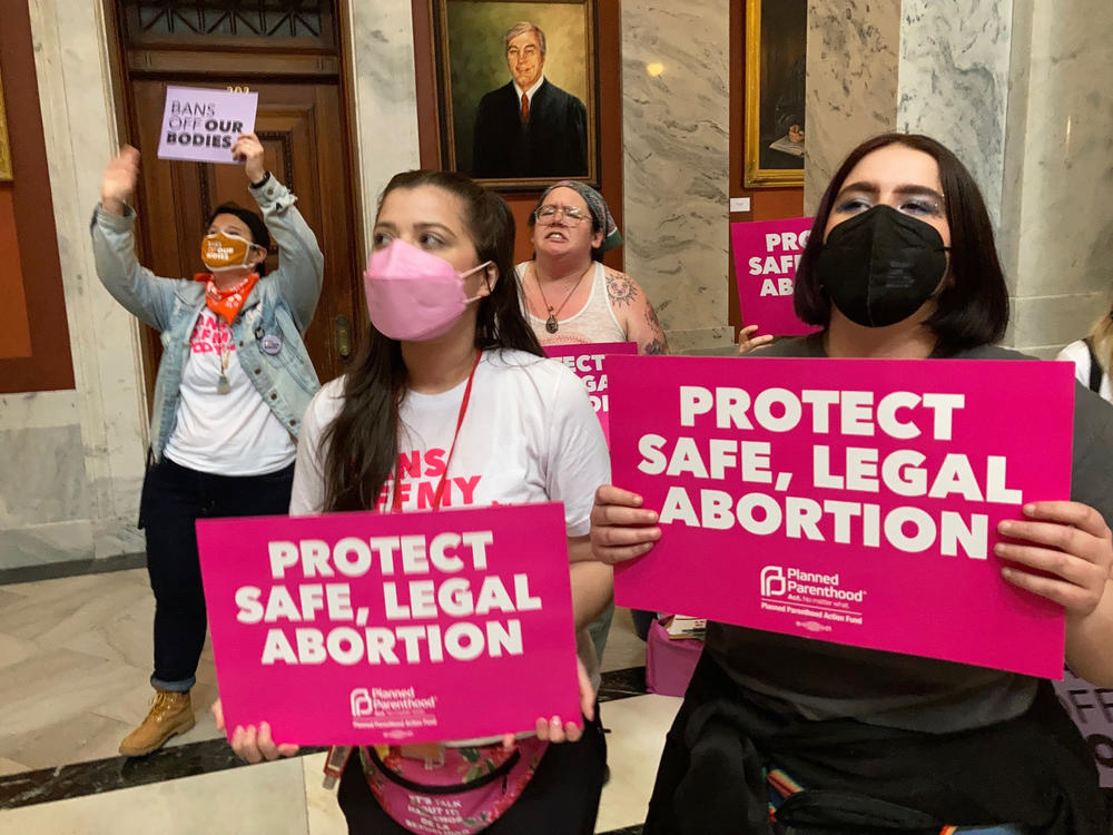 Abortion-rights supporters chant their objections at the Kentucky Capitol in Frankfort on April 13, as state lawmakers debate overriding the governor's veto of an abortion measure.