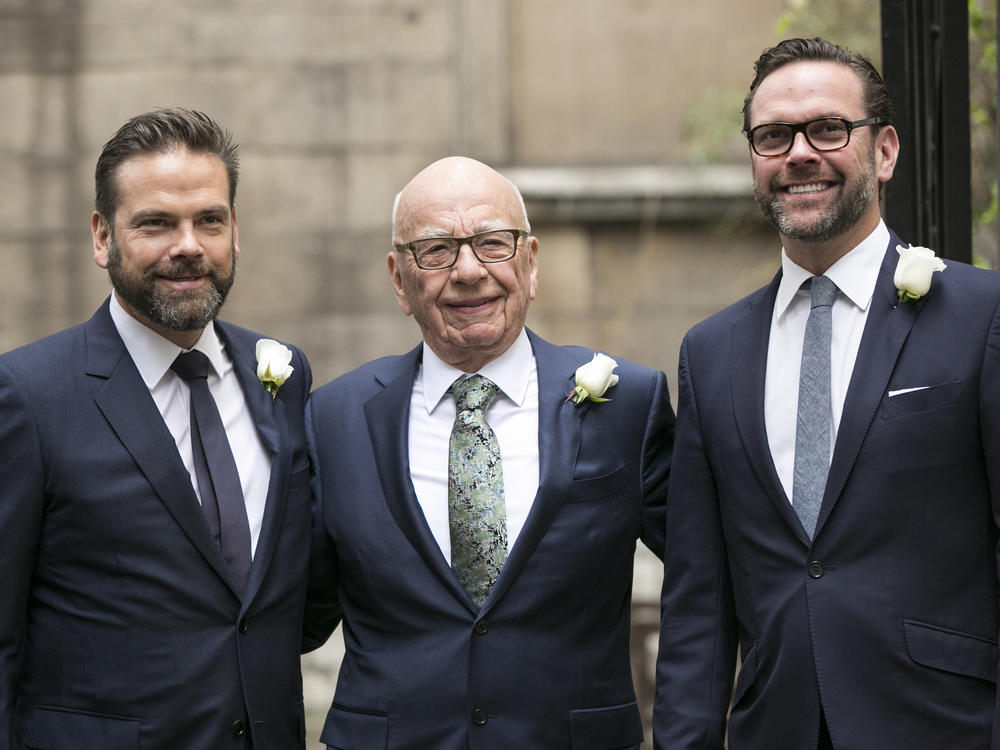 Rupert Murdoch poses with his sons Lachlan (left) and James (right) in London in 2016.