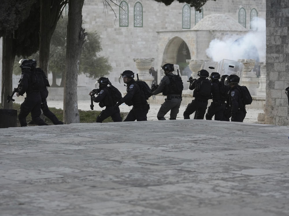 Israeli police clash with Palestinian protesters at the Al Aqsa Mosque compound in Jerusalem's Old City, Friday, April 22, 2022.