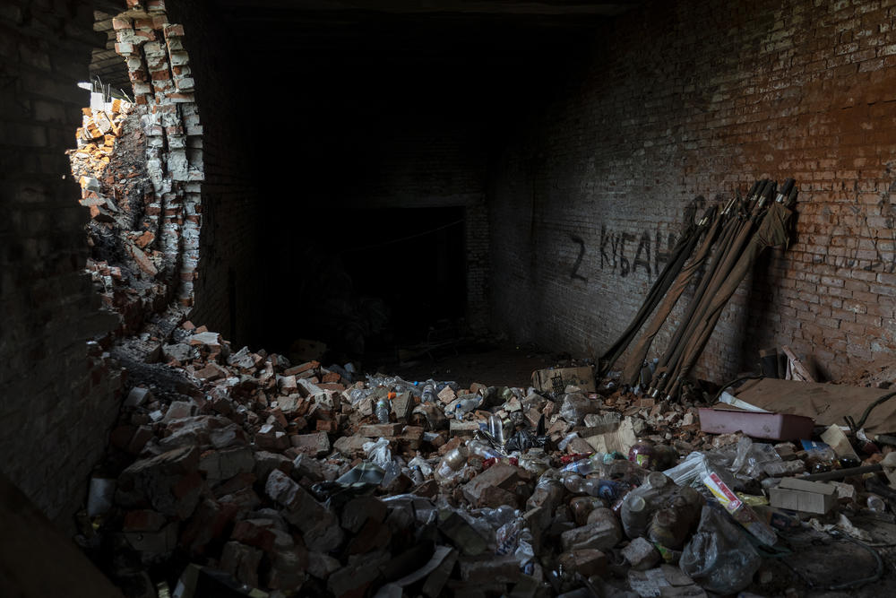 Food supplies left in a damaged building by occupying Russian soldiers in Mala Rohan.