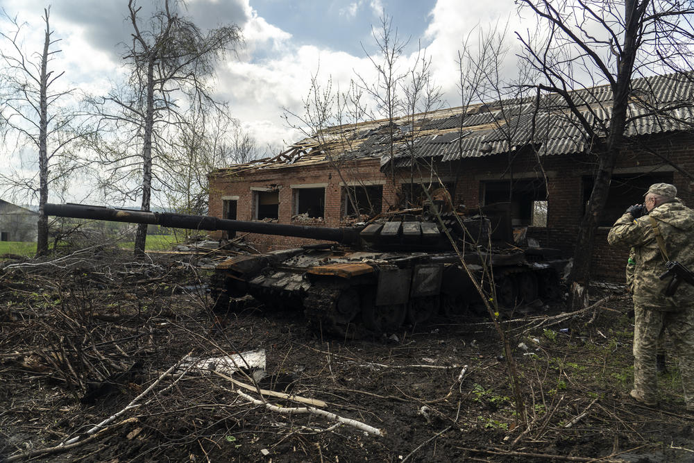 A destroyed Russian military tank sits in Mala Rohan, a village outside of Kharkiv, Ukraine, that was previously occupied by Russian soldiers.