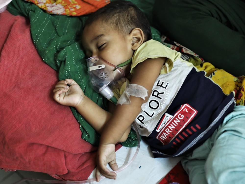 A baby who is suffering from pneumonia receives treatment  at a hospital in Dhaka, Bangladesh on January 13, 2022. A new study points to concerns about childhood deaths after a hospitalization for such diseases as pneumonia, diarrhea and malaria.
