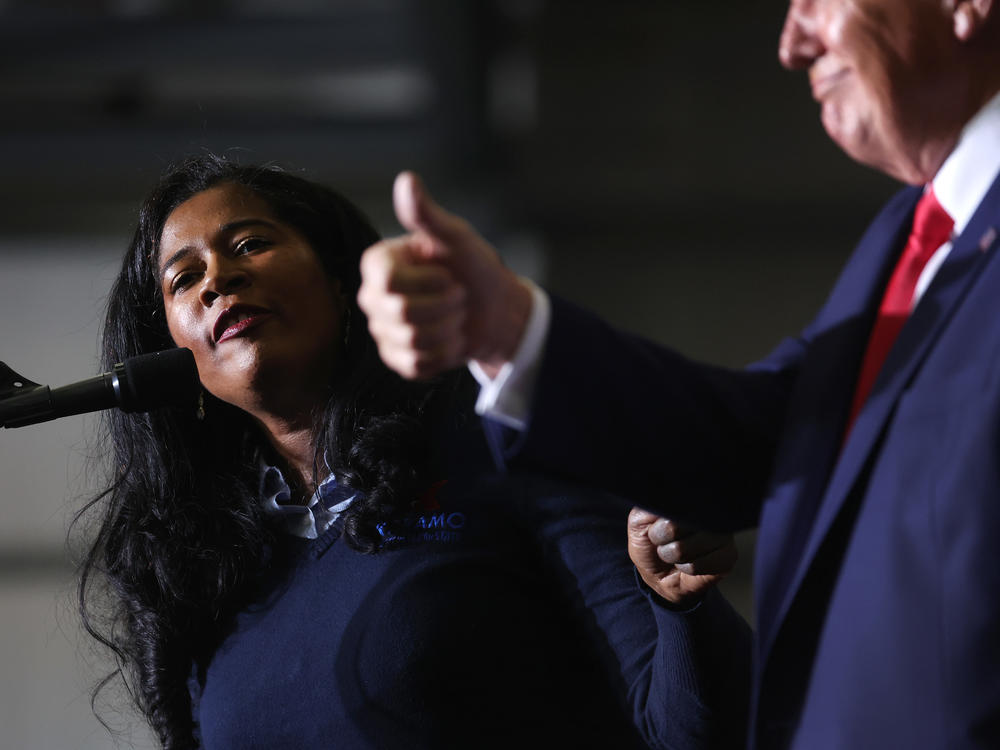 Kristina Karamo, who is running for the Michigan Republican Party's nomination for secretary of state, gets an endorsement from Trump during his April 2 rally.