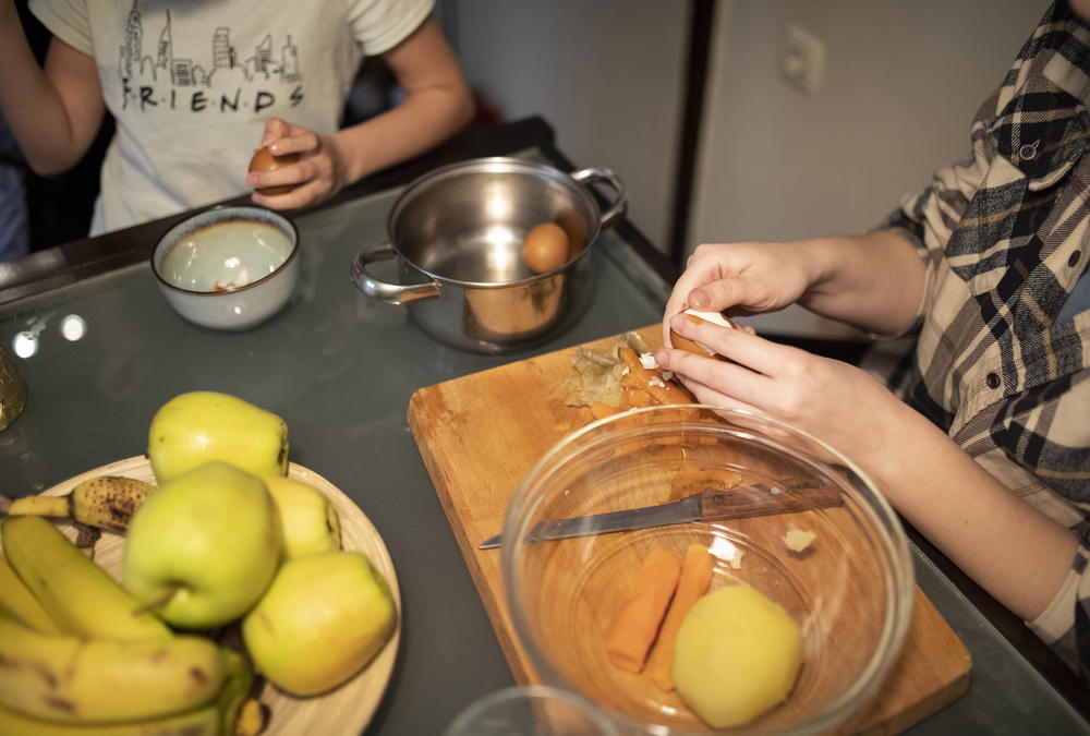 Oleksandra Nykolyn, left, and Anet Pchelnikova, right, prepare dinner at their apartment in Sofia, Bulgaria, on Friday, April 22.