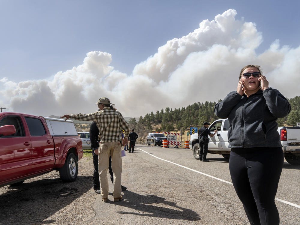 Kylee Moberg tries to get through a road block on N.M. 94 to get to her friend and horses on Friday. Destructive Southwest fires have burned dozens of homes in northern Arizona and put numerous small villages in New Mexico in the path of danger.