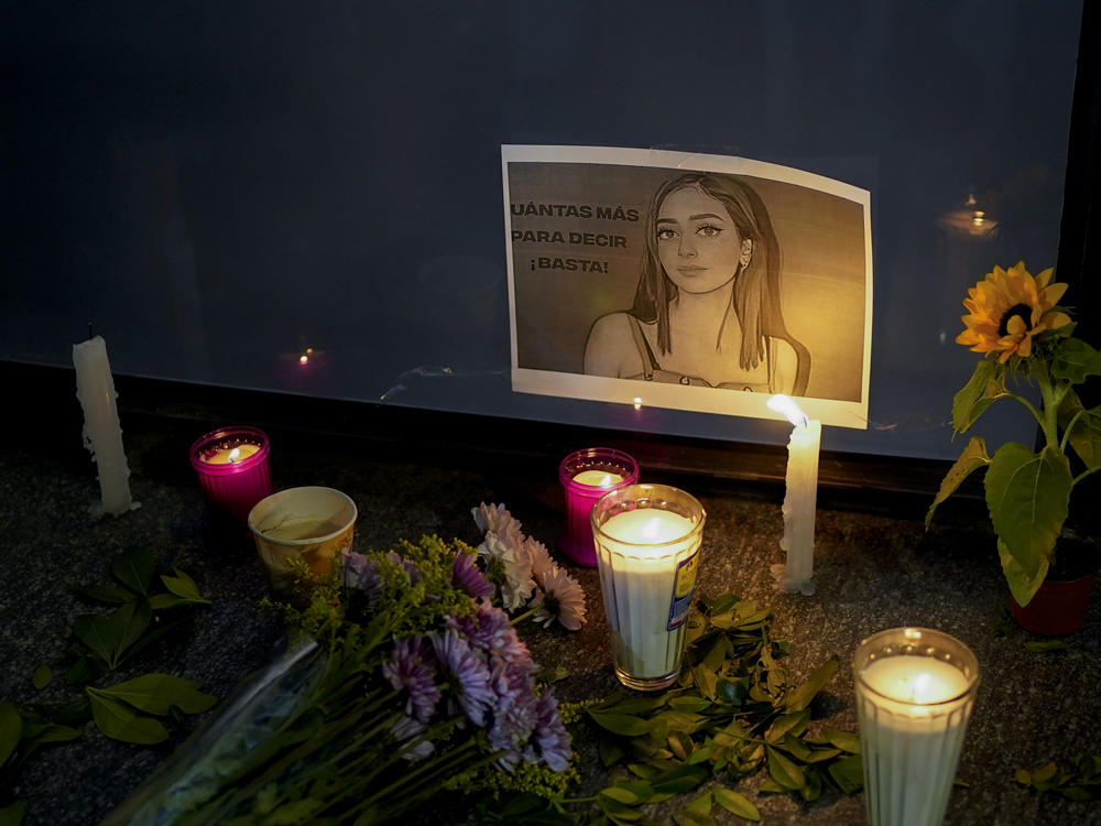 Candles and flowers surround an image of Debanhi Escobar during a protest over her disappearance and other similar cases at the Attorney General's office in Mexico City on Friday.