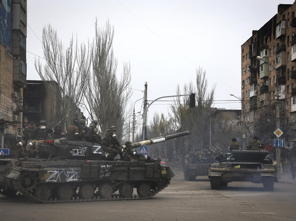 Russian military vehicles move in an area controlled by Russian-backed separatist forces in Mariupol, Ukraine on Saturday.