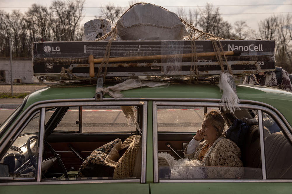 <strong>April 22:</strong> Mariupol resident Varta, 81, rests in the back of her family's car after a four-day journey to an evacuation point for people fleeing from Mariupol, Melitopol and surrounding towns under Russian control in Zaporizhzhia, Ukraine.