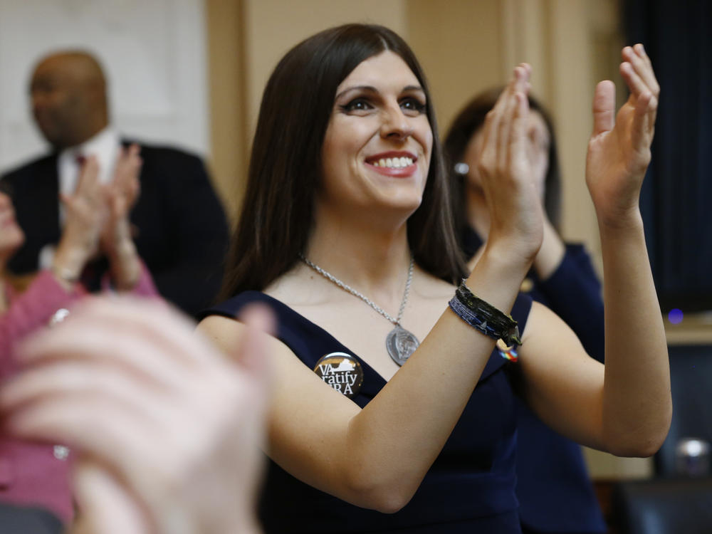 Delegate Danica Roem applauds visitors during opening ceremonies at the start of the 2019 session of the Virginia General Assembly in Richmond. The Virginia lawmaker, the first openly transgender U.S. state legislator, has written a new memoir in which she embraces the idea of using what was written about her to empower her to tell her story.