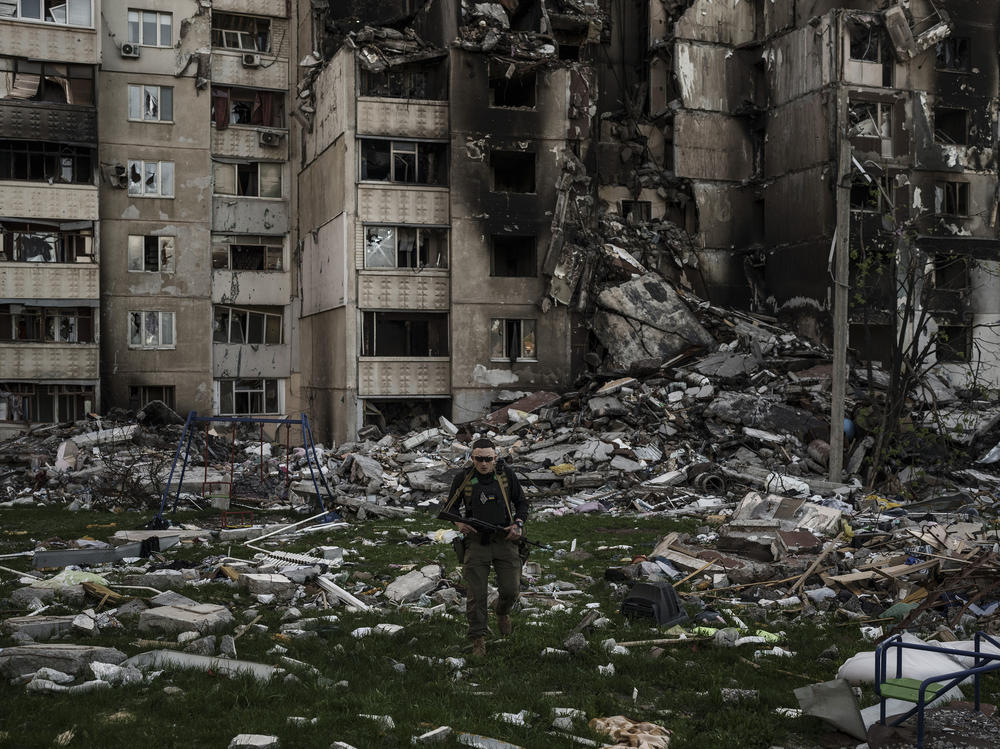 <strong>April 25:</strong> A Ukrainian serviceman walks amid the rubble of a building heavily damaged by multiple Russian bombardments near a frontline in Kharkiv, Ukraine.