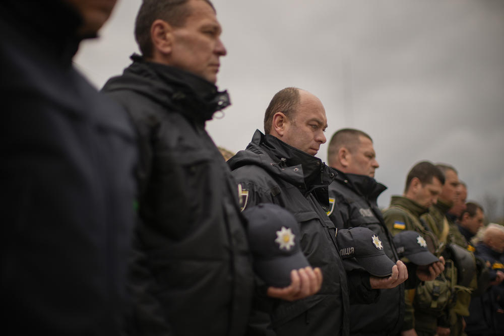 <strong>April 26:</strong> Decorated Ukrainian National Guard soldiers and State Emergency Service units' members observe a minute of silence during a ceremony commemorating the Chernobyl nuclear power plant disaster at the Those Who Saved the World monument in Chernobyl, Ukraine.