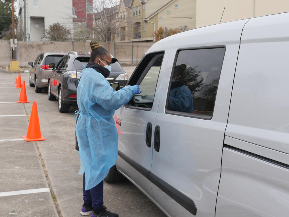 People arrive at a COVID-19 testing station in Houston, Texas, on Jan. 7. Texans were rushing to get tested as the state experienced an unprecedented spike in infections from the omicron variant.