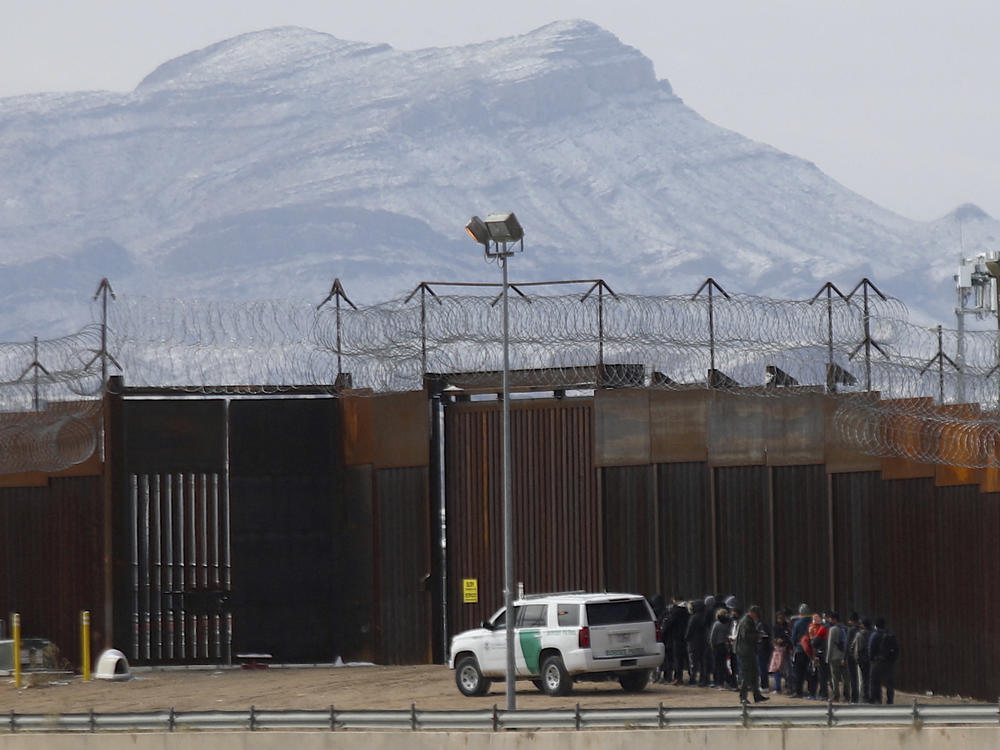 Border Patrol agents detain a group of migrants in El Paso, Texas, near the border wall after they entered the U.S. from Ciudad Juarez, Mexico, in February.