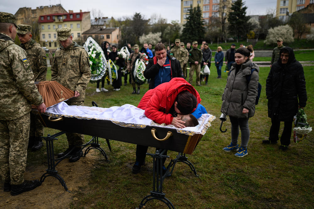 <strong>April 26:</strong> Tamara Kihitova pays her respects to her son during the funeral of 21 year-old Yegor Kihitov, in Lviv, Ukraine. Yegor volunteered in the army but was killed in shelling near Popasna.