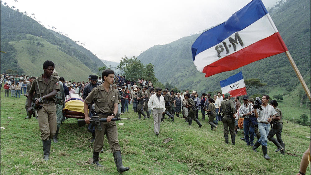 M-19 rebels carry the coffin of Mayor Afranio Parra, days after he was killed by police on April 7, 1989, in Colombia's Santo Domingo mountains before a burial ceremony. M-19 was one of several Colombian leftist guerrilla groups.