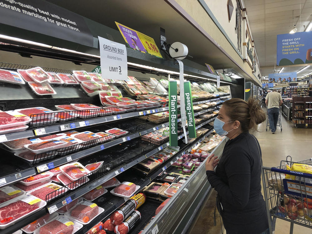 A shopper looks at beef at a Kroger store in Atlanta on May 5, 2020.