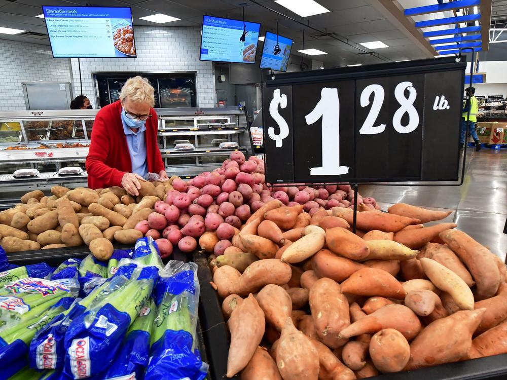 A shopper selects a potato at a supermarket in Rosemead, Calif., on April 21. Inflation remains a top concern for the Federal Reserve.