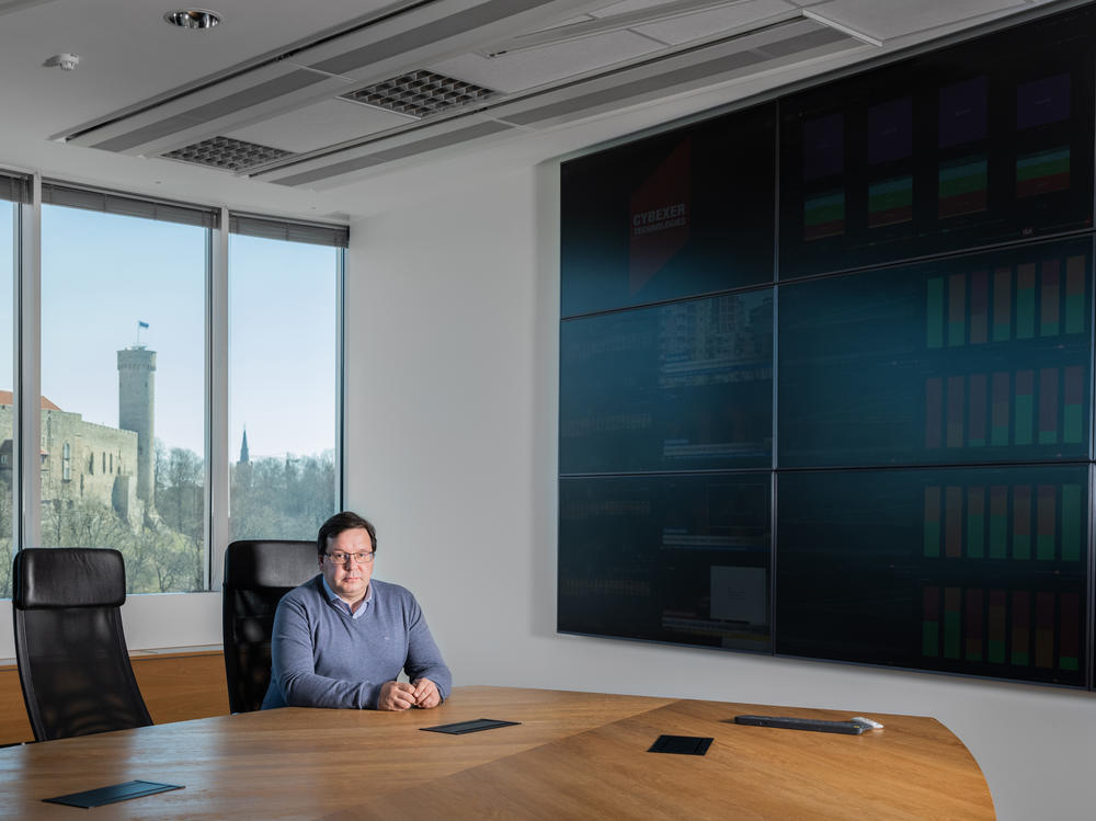 Lauri Almann, co-Founder of CybExer and former Permanent Secretary of Defense, here at the Cyberex office with view of Old Town of Tallinn.