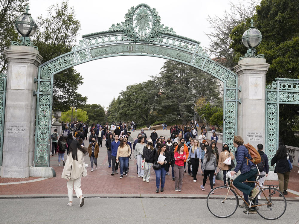 Students make their way through the Sather Gate near Sproul Plaza on the University of California, Berkeley, campus on March 29 in Berkeley, Calif.