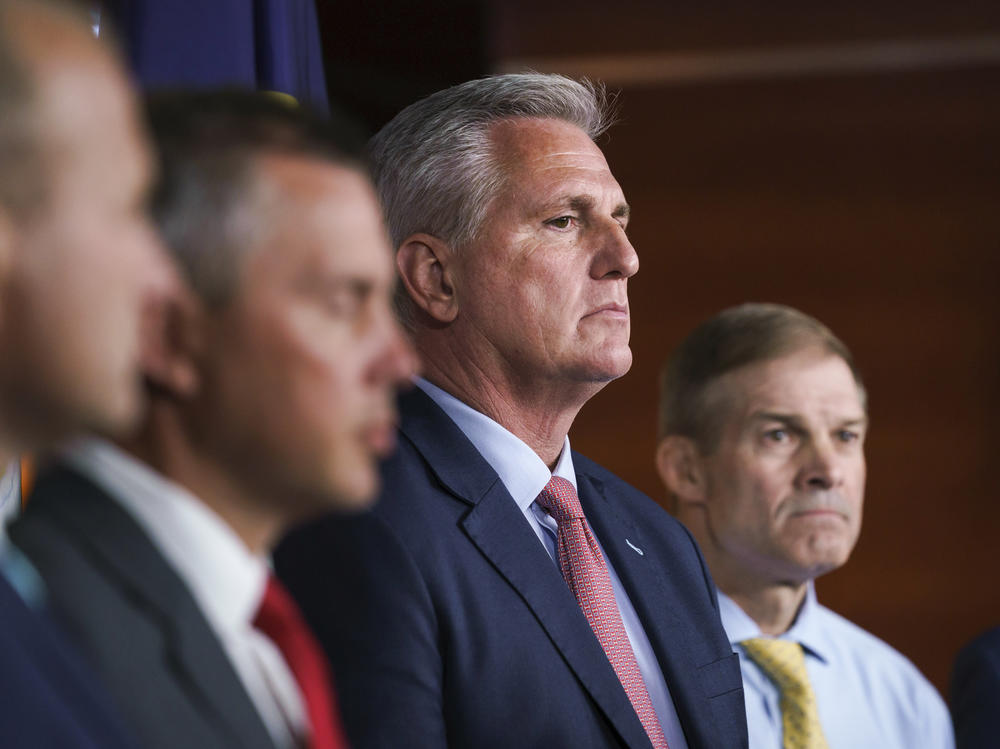 House Minority Leader Kevin McCarthy, R-Calif., center, joined at right by Rep. Jim Jordan, R-Ohio, pause during a news conference on July 21, 2021.