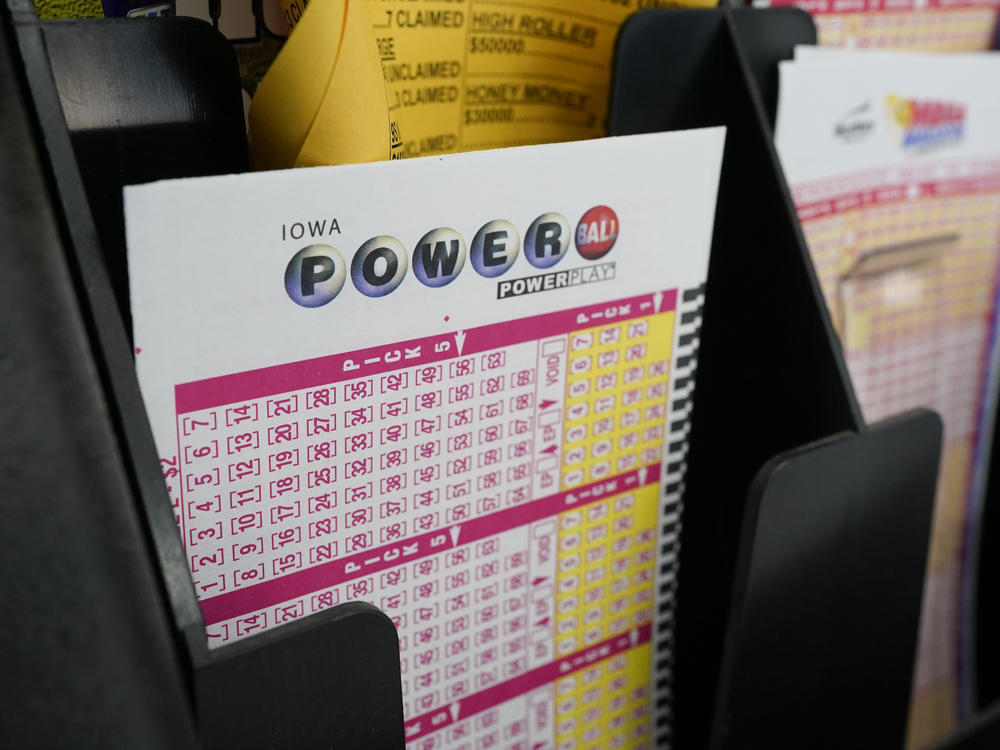 Blank forms for the Powerball lottery sit in a bin at a grocery store, in Des Moines, Iowa, on Jan. 12, 2021.