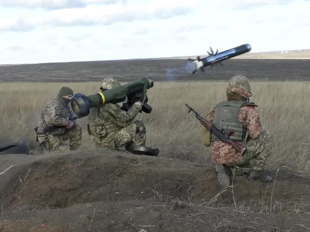 In this image taken from footage provided by the Ukrainian Defense Ministry Press Service, Ukrainian soldiers use a launcher with U.S. Javelin missiles during military exercises in the eastern Donetsk region of Ukraine, on Jan. 12. The U.S. and NATO allies have been ramping up military aid to help Ukraine fend off Russian forces.