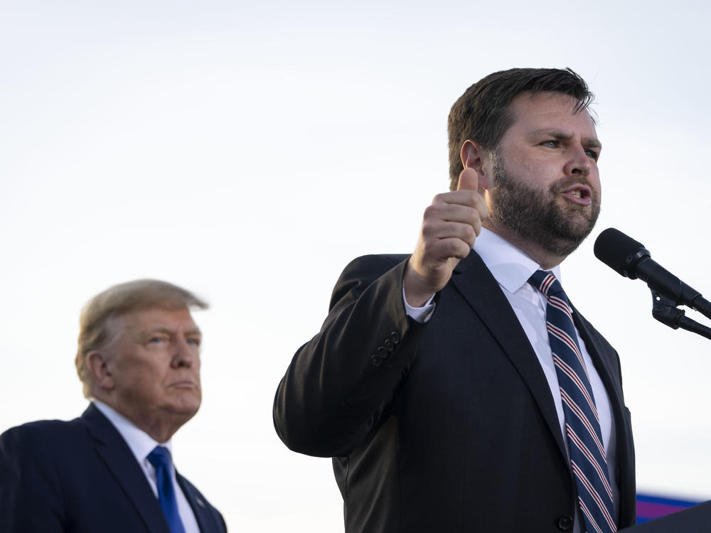 Former President Trump listens as J.D. Vance, a Republican candidate for U.S. Senate in Ohio, speaks during a rally hosted by Trump on April 23, 2022, in Delaware, Ohio. Trump had announced his endorsement of Vance in the Republican primary the week before.