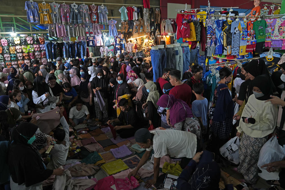 Shopers at Tanah Abang market in Jakarta on Thursday. Muslims around the world are preparing for the Eid al-Fitr holiday, which is usually marked with feasts and celebration.