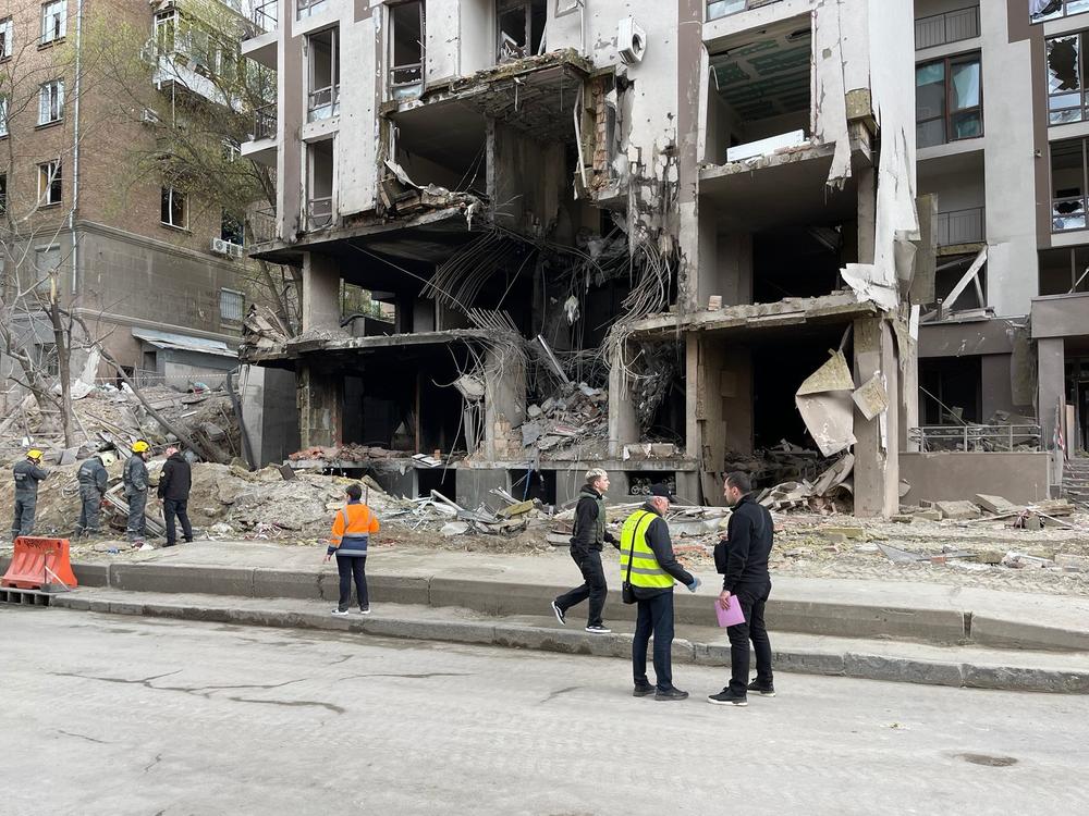 An apartment building in Kyiv was hit by a Russian attack on Thursday, killing a journalist who lives there. It's next to a factory that makes missile parts — but also vacuum cleaners.