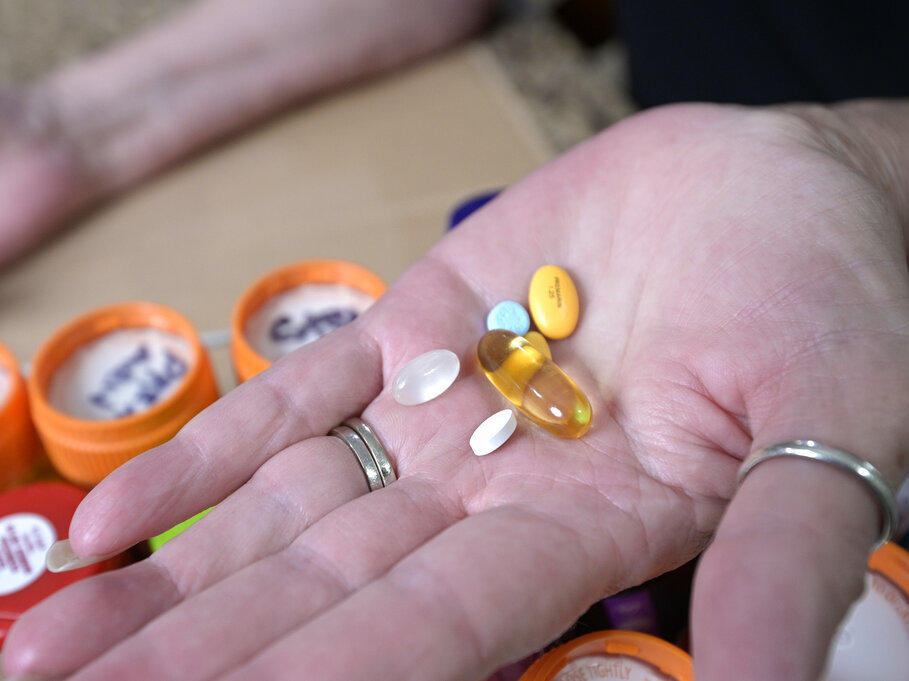 Retiree Donna Weiner shows some of the daily prescription medications for which she pays more than $6,000 per year through a Medicare prescription drug plan. She supports giving Medicare authority to negotiate drug prices.